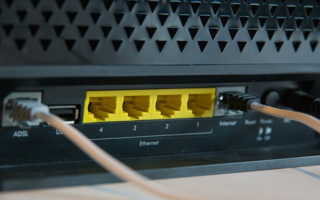 Rear ports of a router with Ethernet cables connected