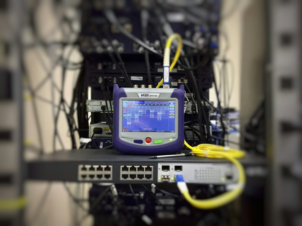 Network tester connected to a rack-mounted switch