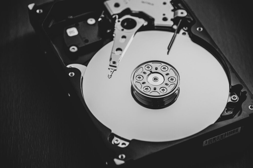 Opened hard disk drive in black and white