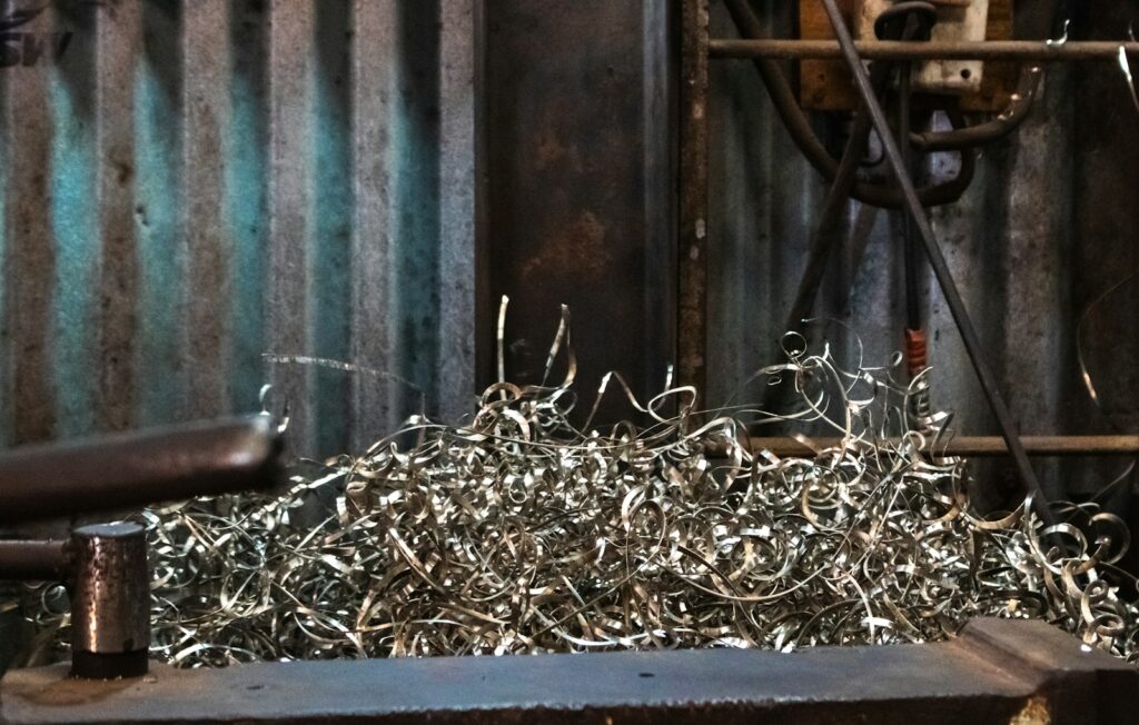 Pile of shredded metal pieces in a workshop