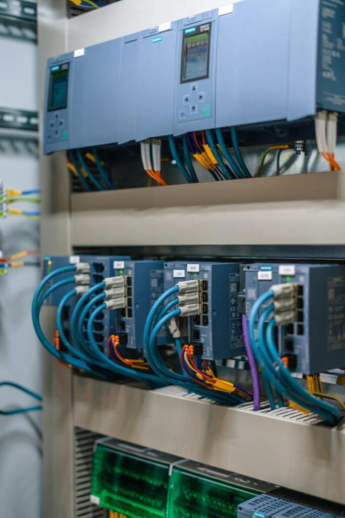 Rack of network modules with blue Ethernet cables