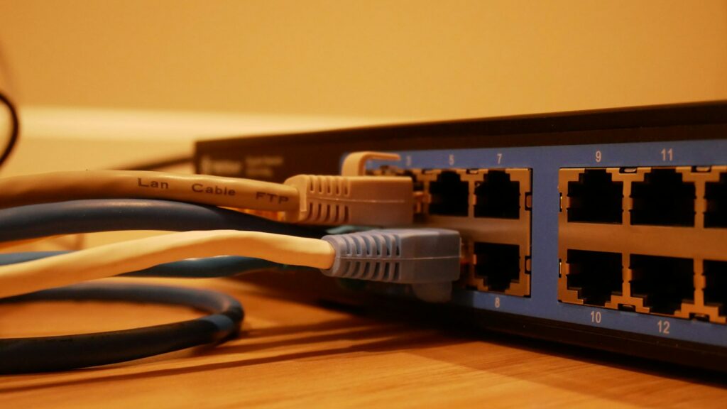 Network switch with Ethernet cables plugged into its ports